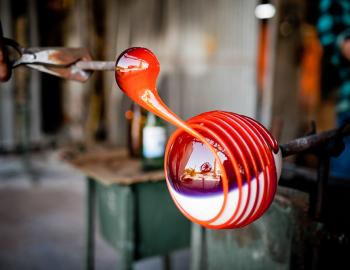 close up image of hot glass figure being made